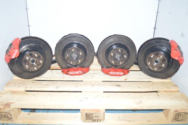 JDM Red Subaru 4 Pot 2 Pot Brakes with Hubs, Trailing Arms, Rotors and Pads from a 2006-2007 WRX